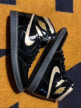 Nike Black Patent High-Top Sneakers with Cream Swoosh and Gold Logo